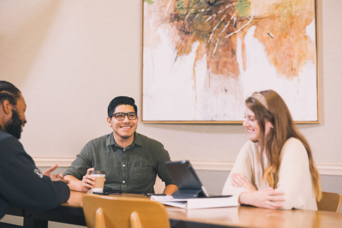 Students and professor talking